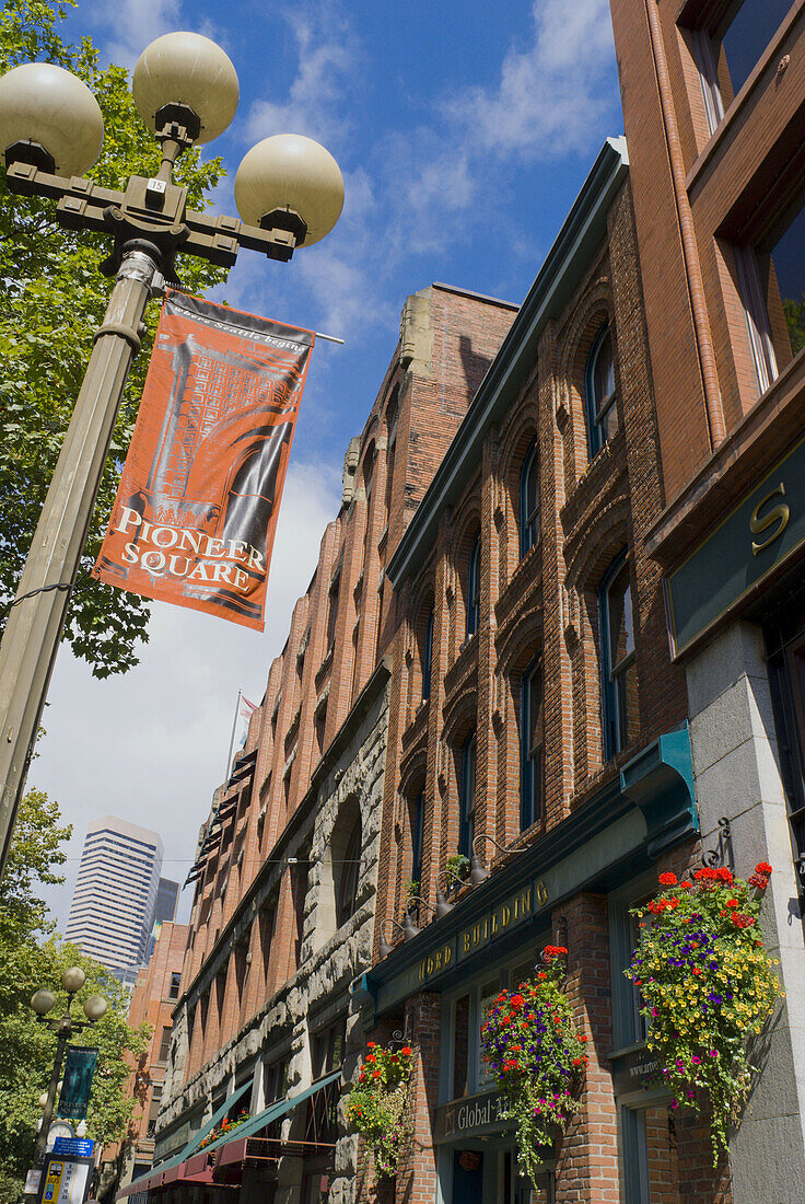 Banner and brick buildings in Pioneer Square, Seattle, Washington, USA
