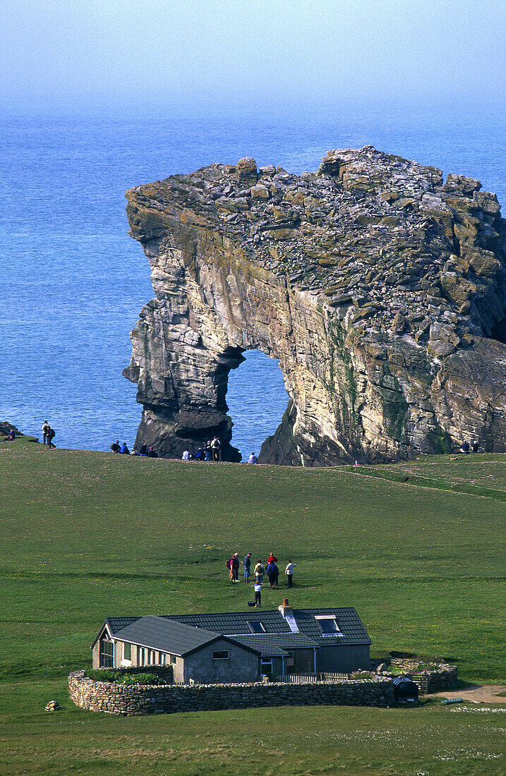 Farmhouse and tourists, Foula Island, Shetland Islands, Scotland.