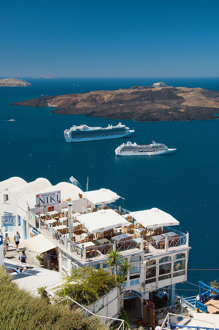 Cruise ships in the caldera of Santorini from Fira on the Greek Island of Santorini, Greece.