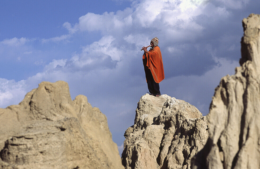 Man playing Andean flute. Valley of the Moon, La Paz, Bolivia