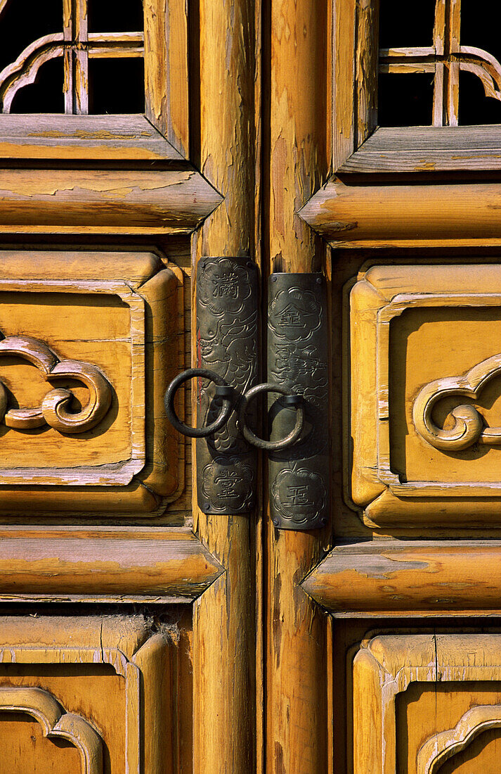 Doors with intricate wood work, Kunming, Yunnan, China