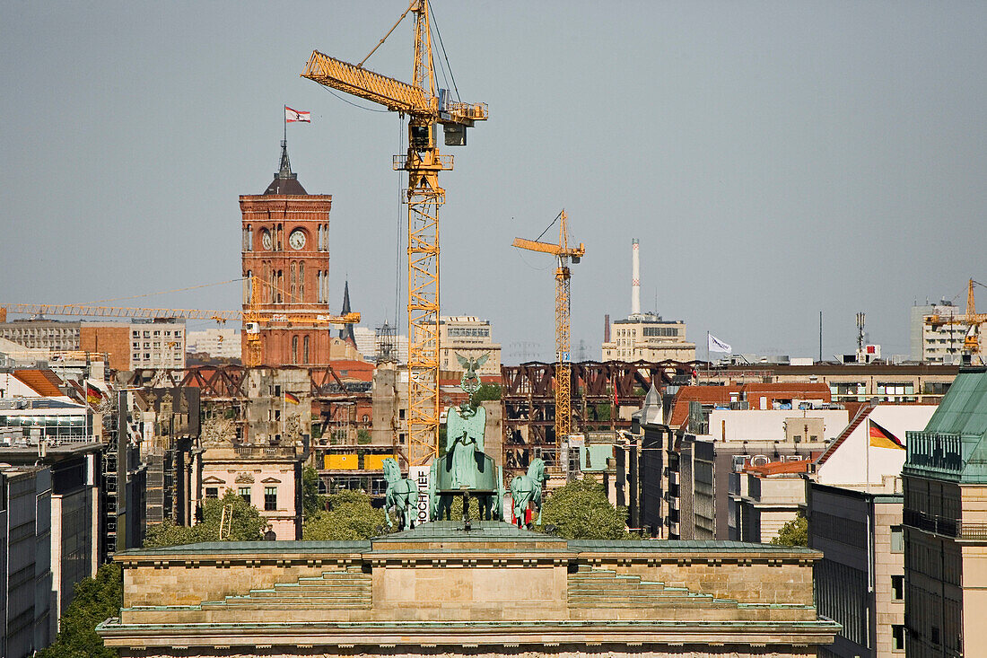 building cranes, town hall, top of Brandenburg Gate, Berlin, Germany
