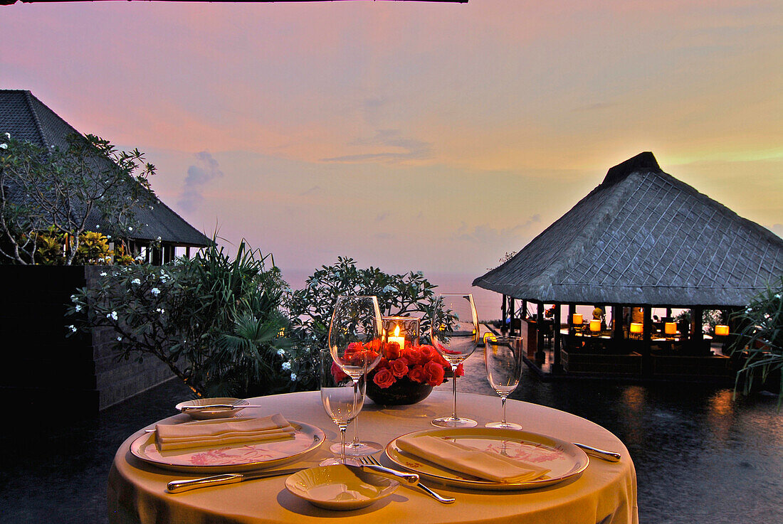 A table is laid at the restaurant at Bulgari Resort in teh evening, Bukit Badung, Southern Bali, Indonesia, Asia