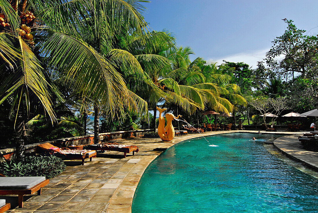 Pool under palm trees, Gajah Mina Beach Resort, South Bali, Indonesia, Asia