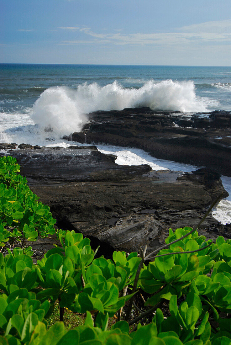 Rocky coast and surf in the sunlight, South Bali, Indonesia, Asia