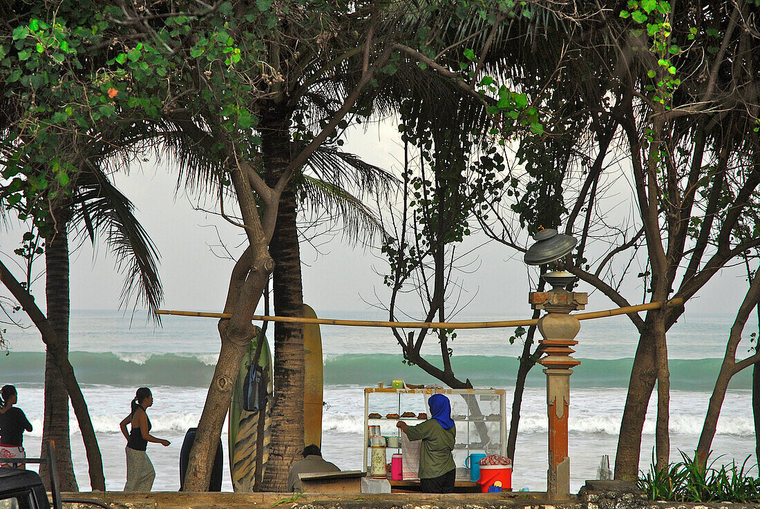 Local people at Kuta beach in the morning, Kuta, Bali, Indonesia, Asia