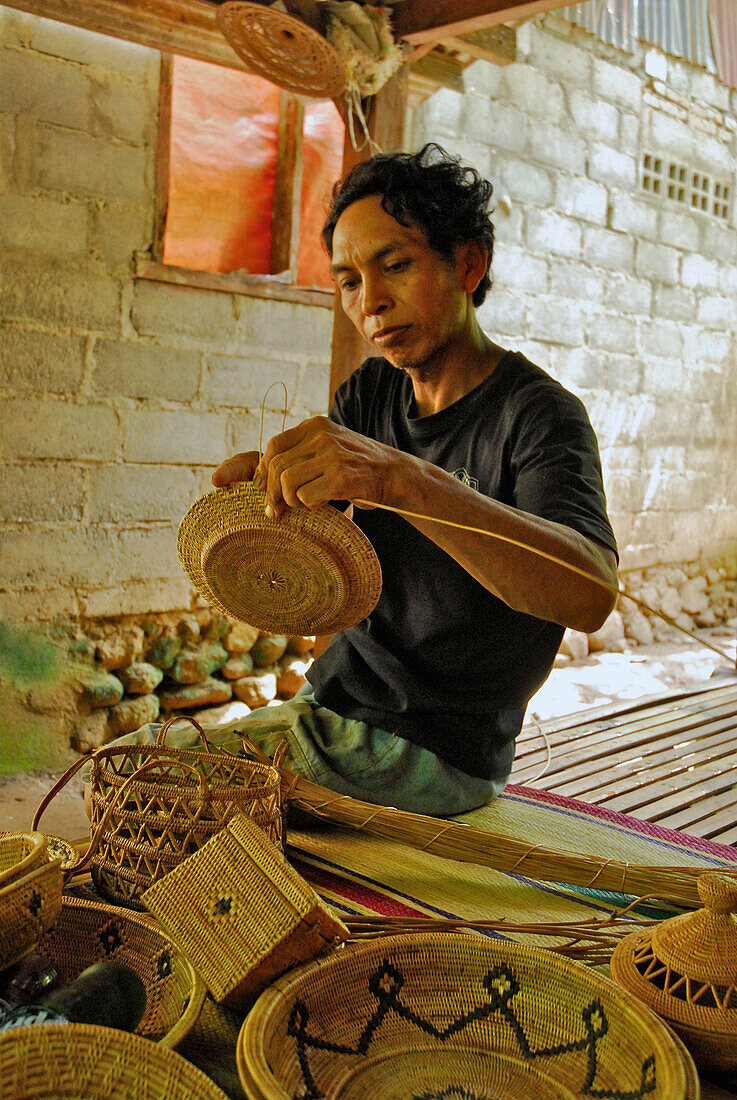 A basket maker at work, Tenganan, Bali Aga village, East Bali, Indonesia, Asia