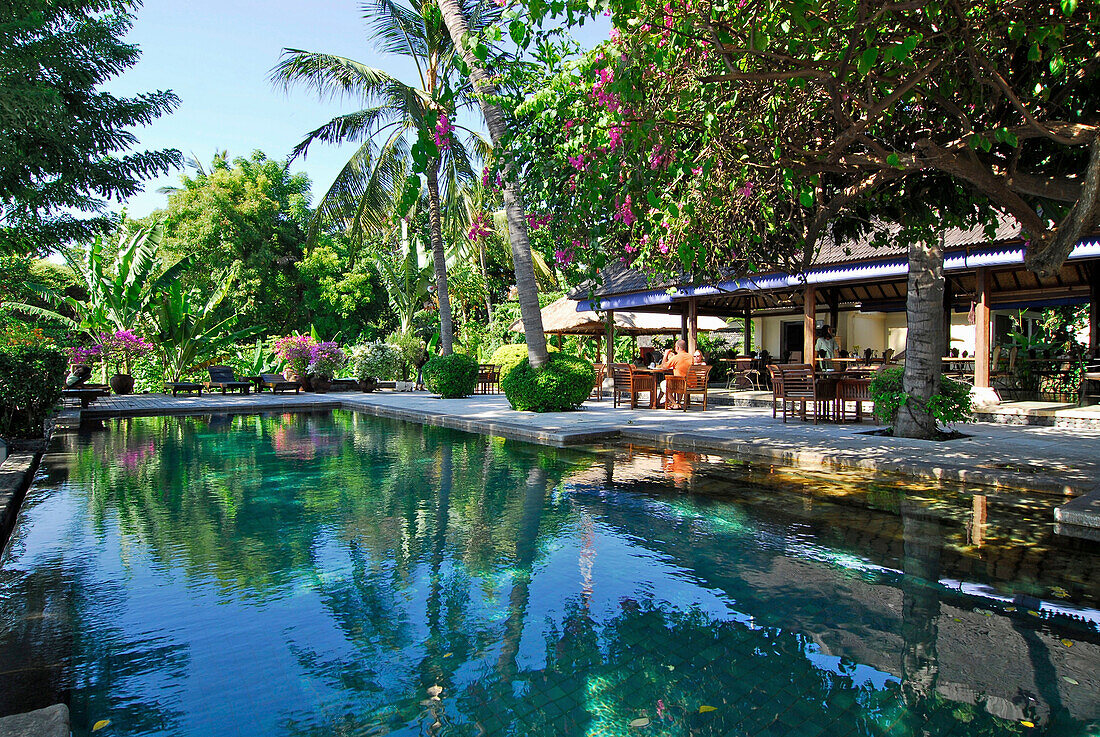 Pool under palm trees at Mimpi Resort, Tulamben, North East Bali, Indonesia, Asia