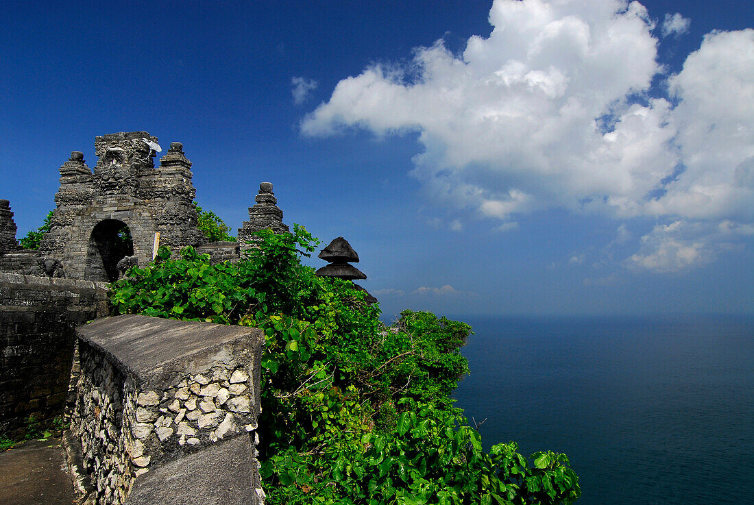 Temple Pura Luhur Uluwatu on a cliff under blue sky, South Bali, Indonesia, Asia