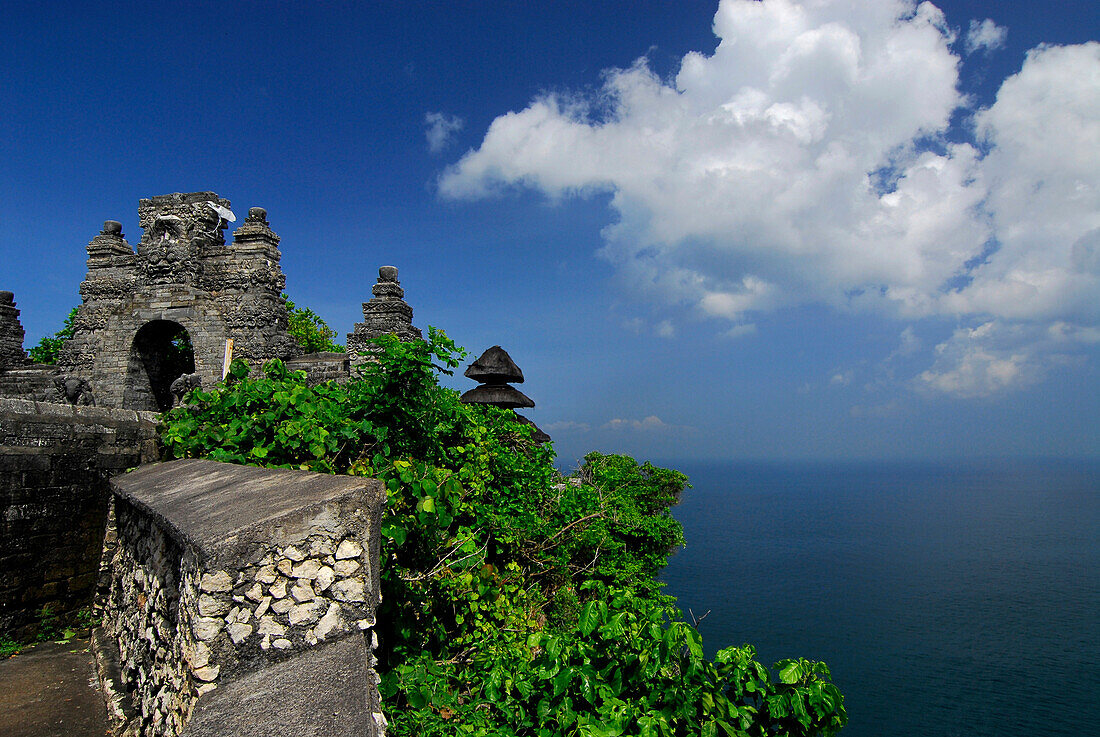 Temple Pura Luhur Uluwatu on a cliff under blue sky, South Bali, Indonesia, Asia