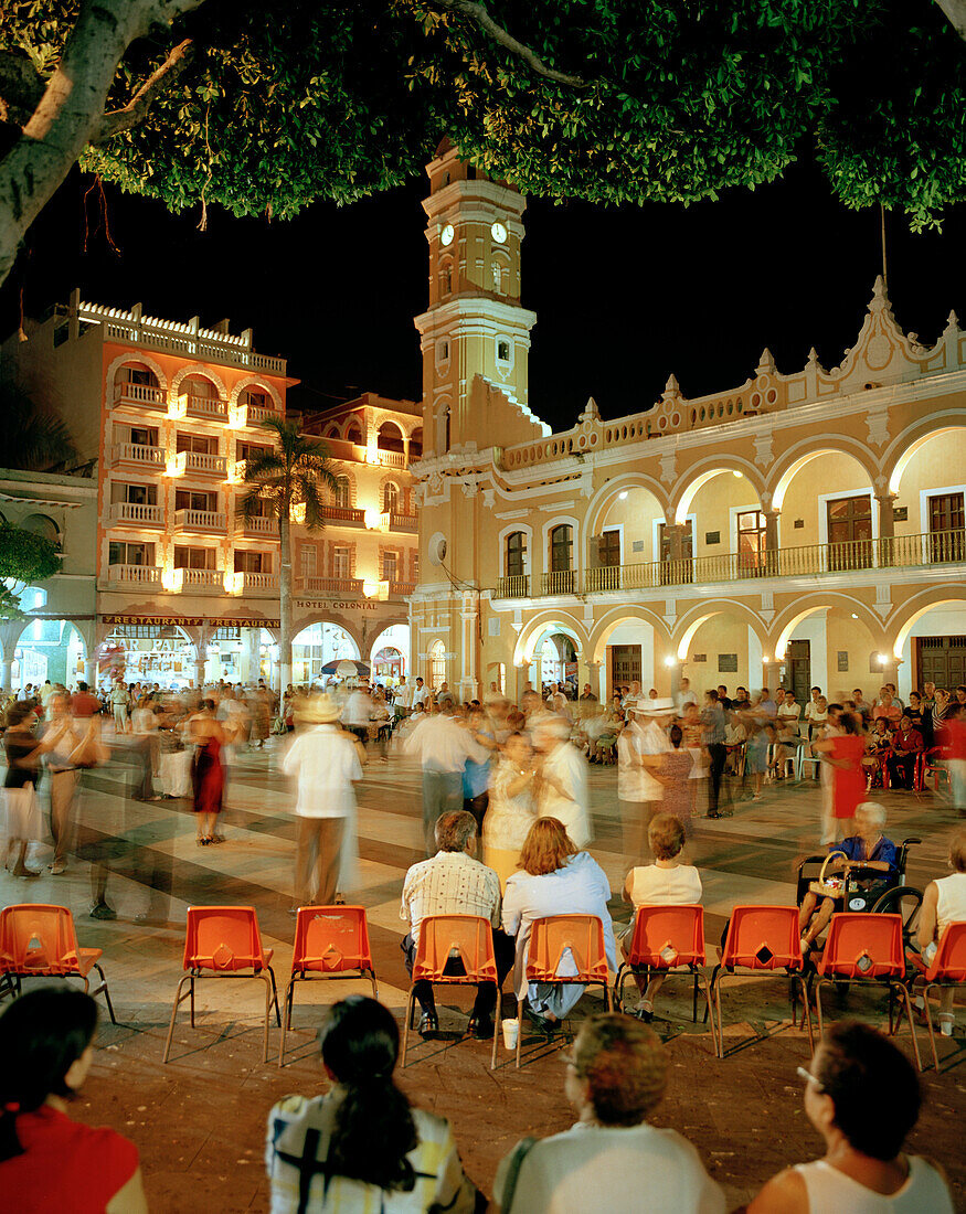 People dancing on the Zocalo in front of the town hall Palacio Municipal at the Old Town in the evening, Veracruz, Veracruz province, Mexico, America