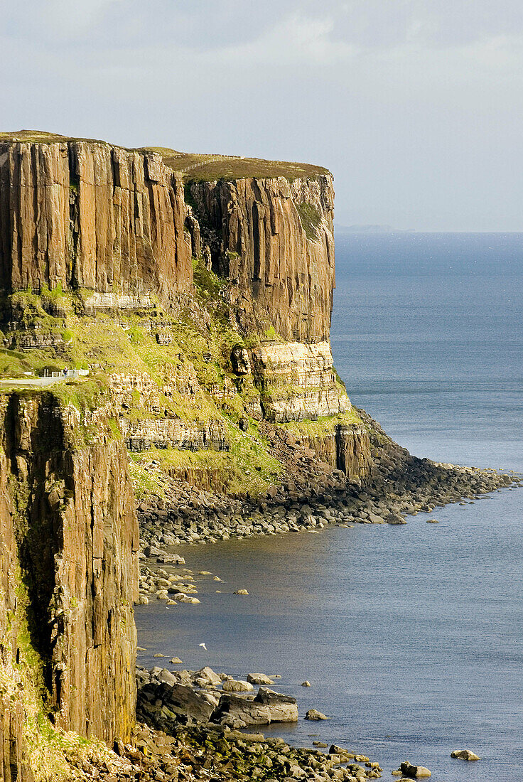 Dunite cliffs on the coast of Isle of Skye Scotland, Kilt Rock is in the distance.