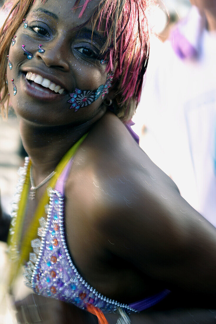 Young afro-american lady dancing to the rhythm of the caribbean Soca music at the Trinidad Carnival, Queens Park Savannah, Port of Spain, Island of Trinidad, Republic of Trinidad and Tobago