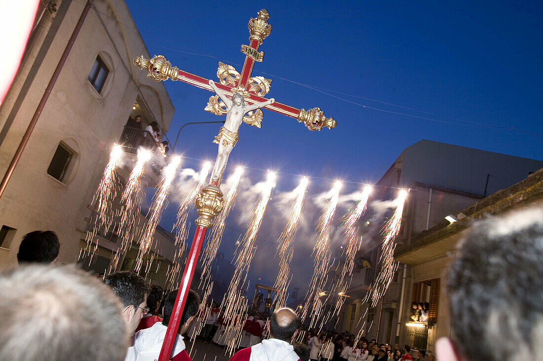 Cross and fireworks during the Easter processions. Ispica. Sicily. Italy