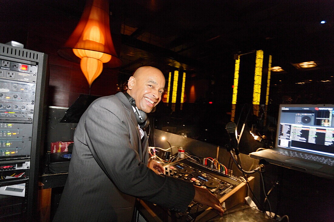 DJ Jimmy Knowles in the Taj Lounge Salsa club, Manhattan, New York City, New York, USA