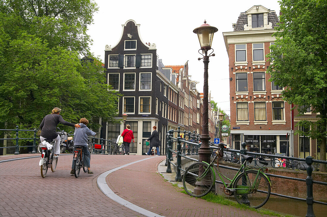Street setting, people at the Old Town of Amsterdam, Netherlands, Europe