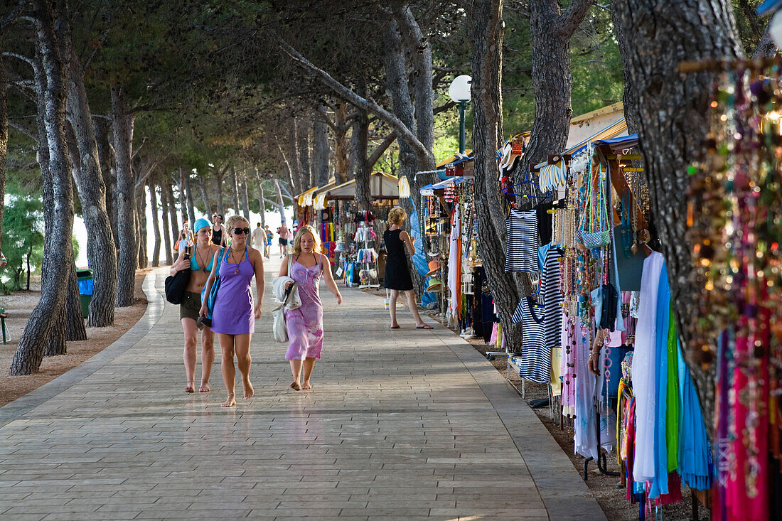 Tourists and sales stalls at the promenade, Bol, Brac Island, Dalmatia, Croatia, Europe