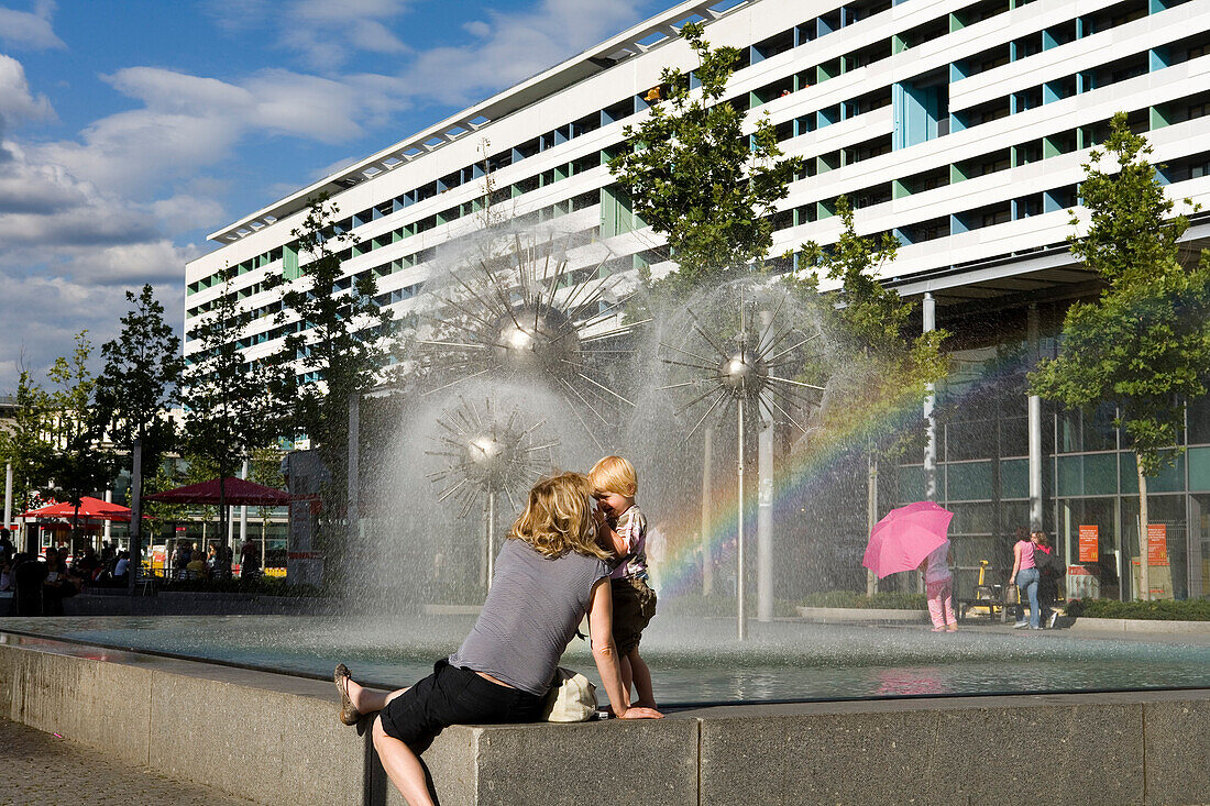 Mother and child at fountain, Prager Strasse, Dresden, Saxony, Germany