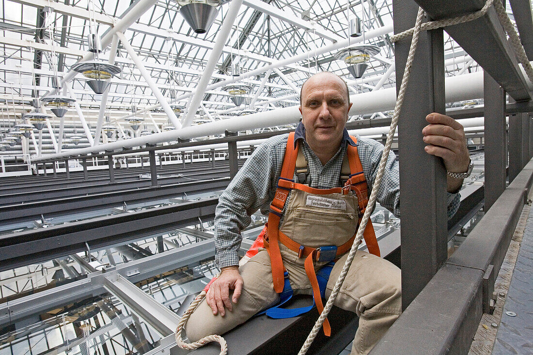 industrial climber, under a steel roof structure, Berlin, Germany