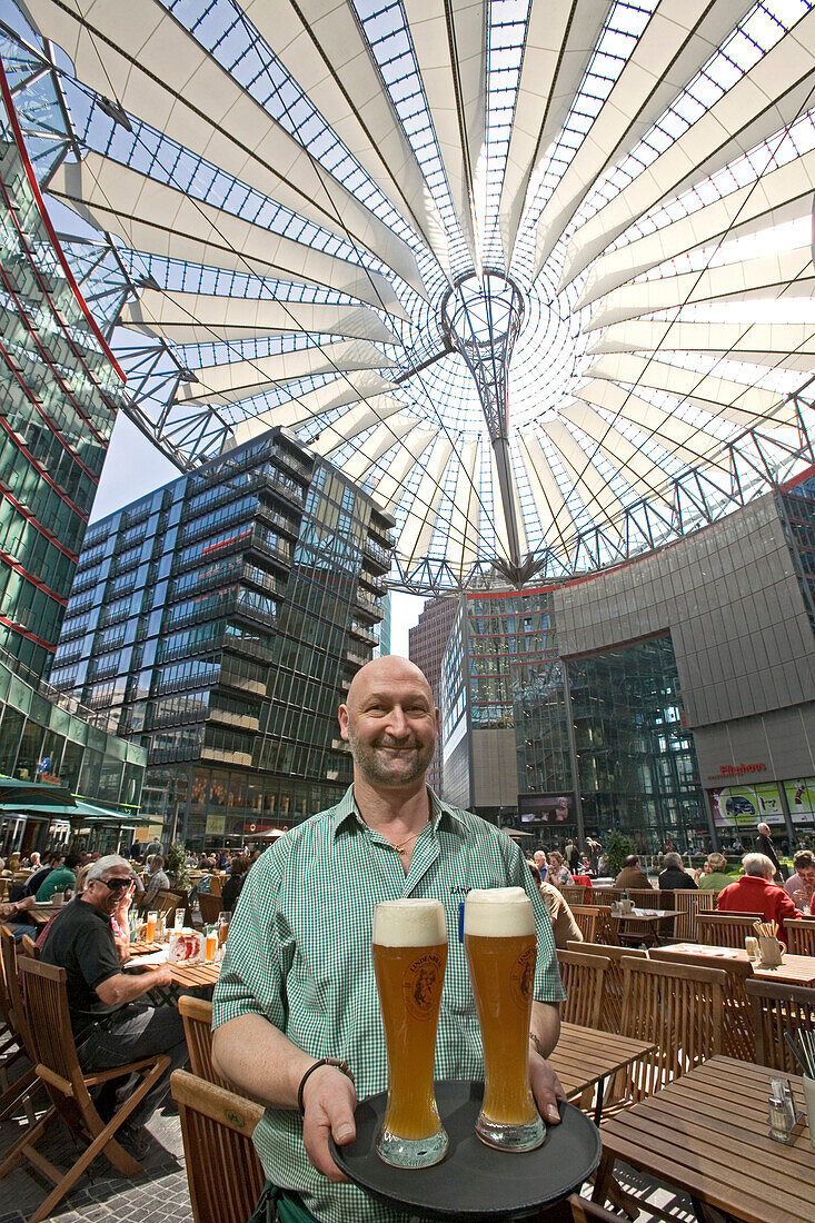 Café Sony Center, waiter with glasses of beer, Berlin, Germany