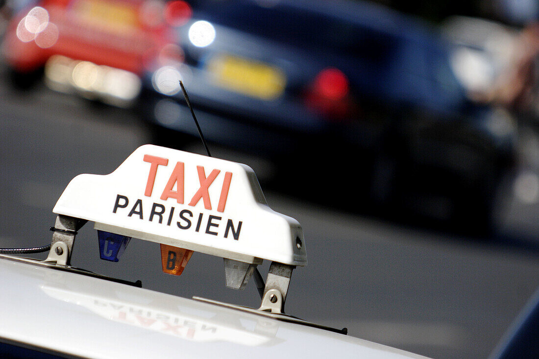 TAXI sign on top of a parisian taxi. Paris. France