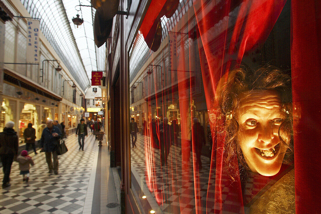 A wax figure in the window of Musee Grevin inside of Passage Jouffroy. Paris. France