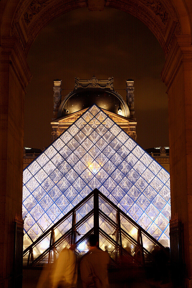 The night view of Pyramid Entrance of Musee du Louvre from Denon Wing. Paris. France