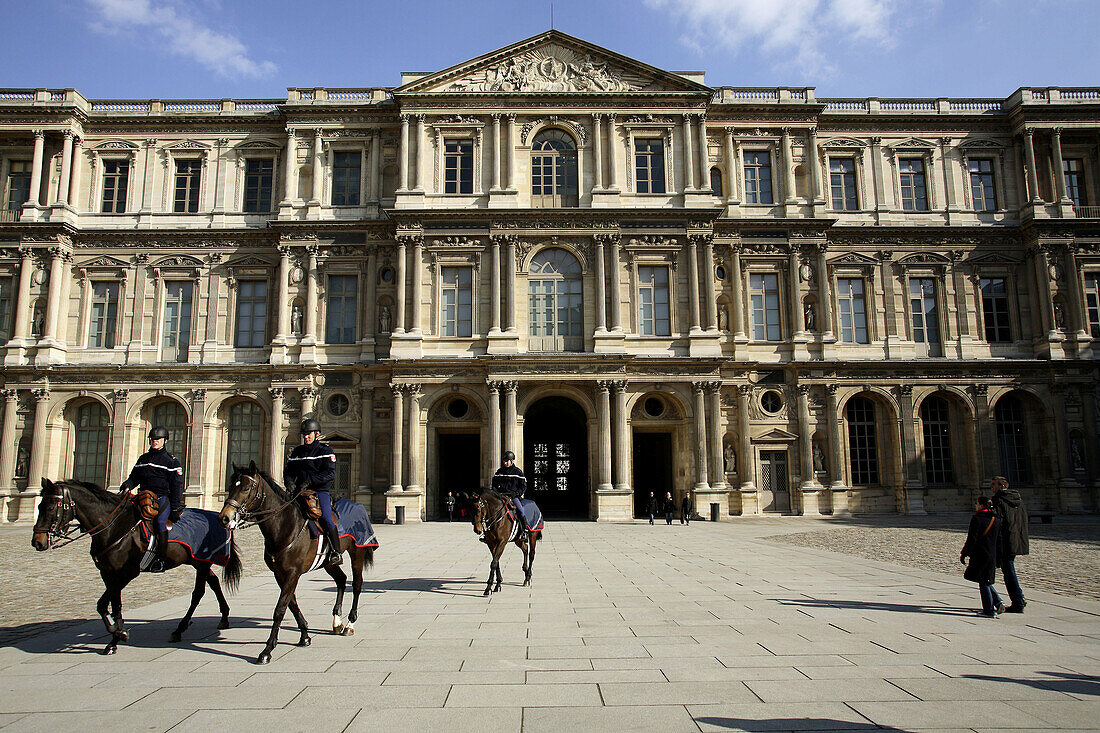 Mount police patrol in Cour Carree of Musee du Louvre. Paris. France