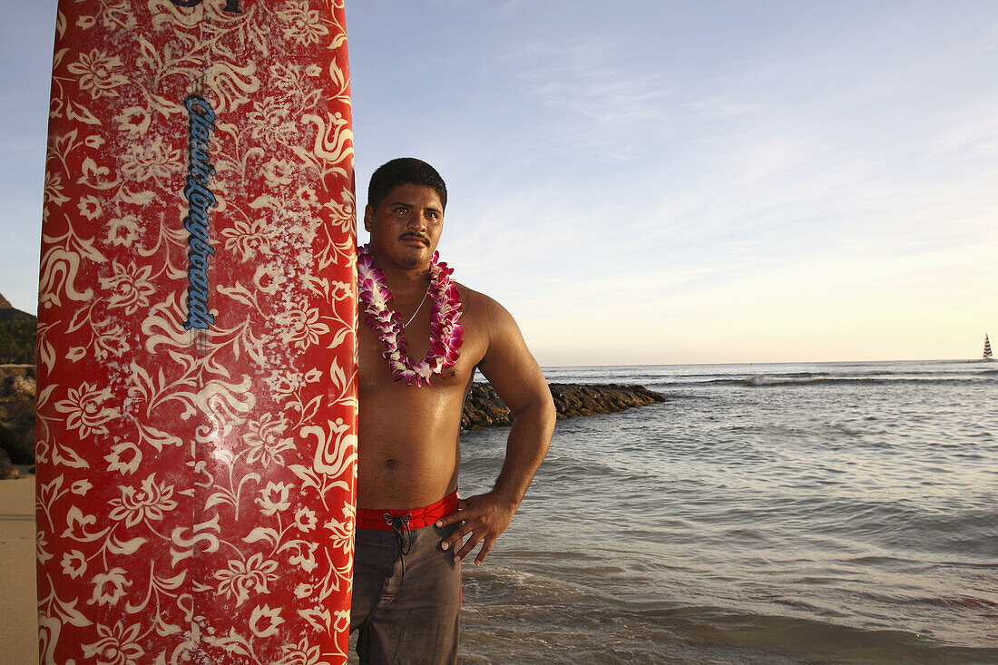 A Hawaiian surfer on Waikiki Beach. Oahu Island. Hawaii. USA