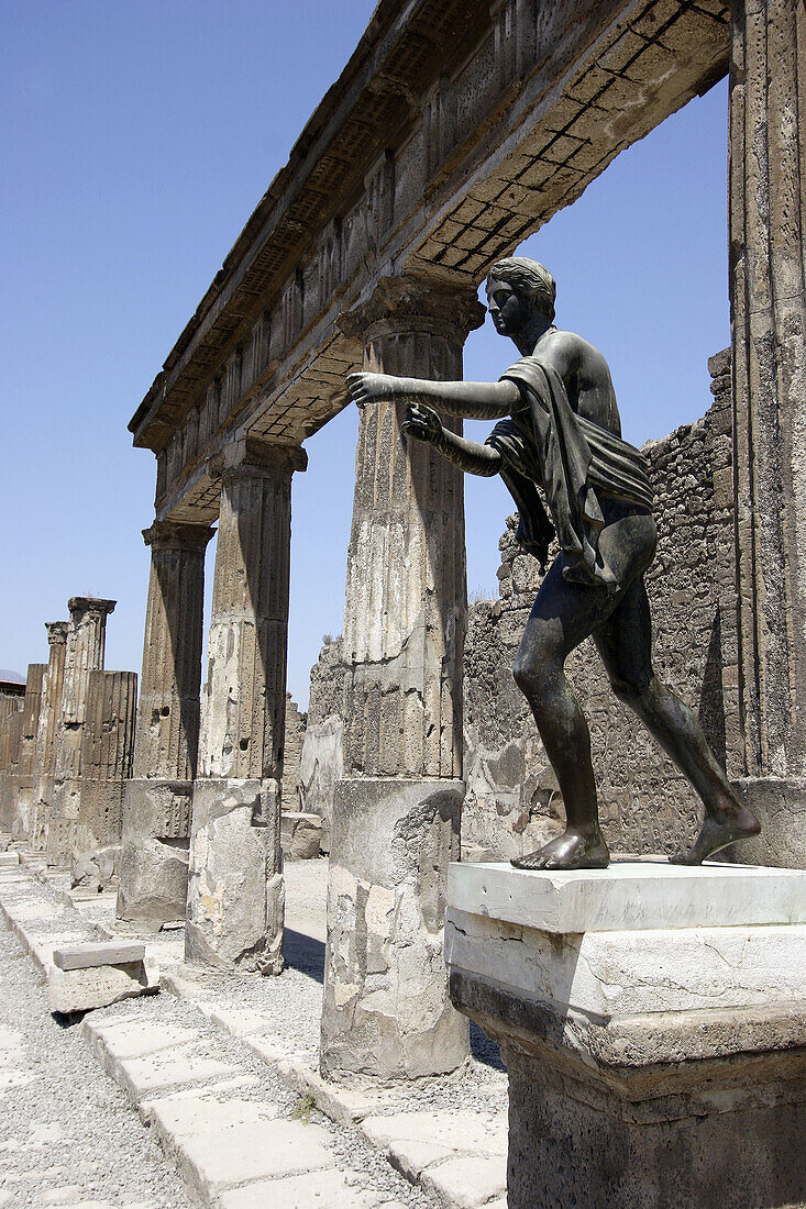 The statue of Apollo in the ruins of Temple of Apollo. Pompei. Campania. Italy