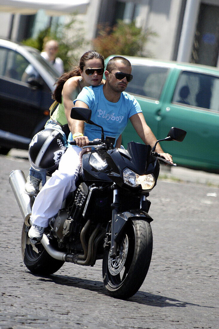 A young couple on a motorcycle. Naple. Campania. Italy