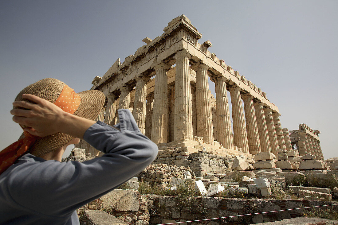 A visitor in front of Parthenon on Acropolis. Athens. Greece