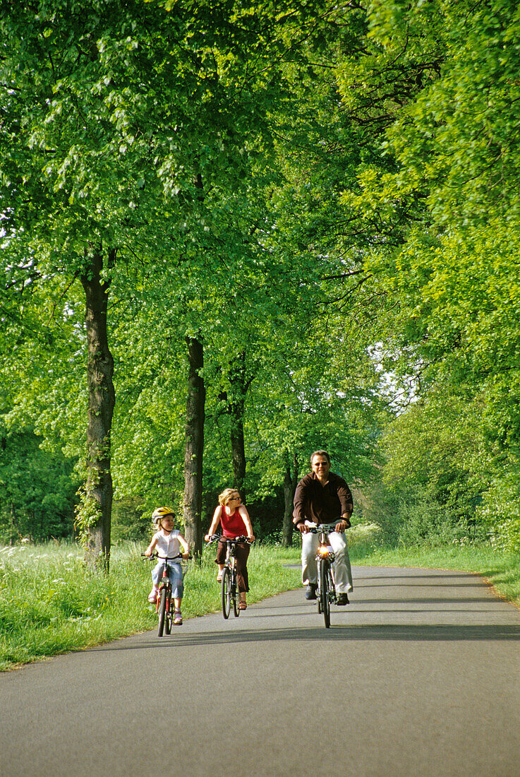 Family cycling, Muenster, North Rhine-Westphalia, Germany