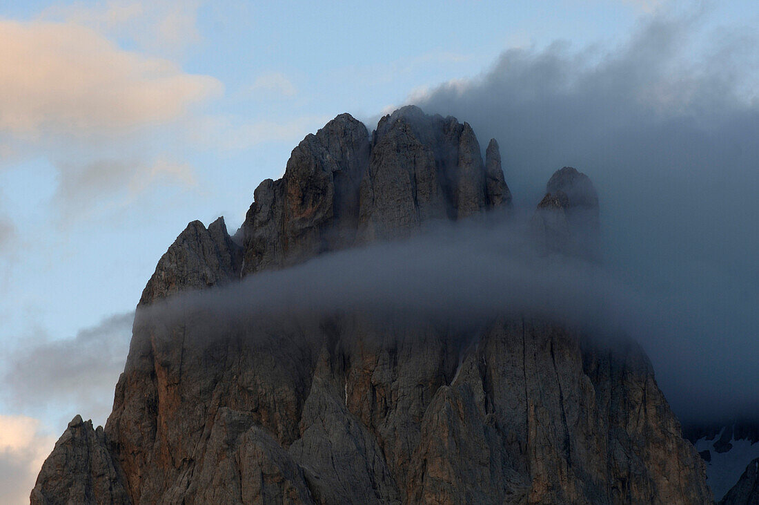 Grey cloud over a mountain peak, Dolomites, South Tyrol, Italy, Europe