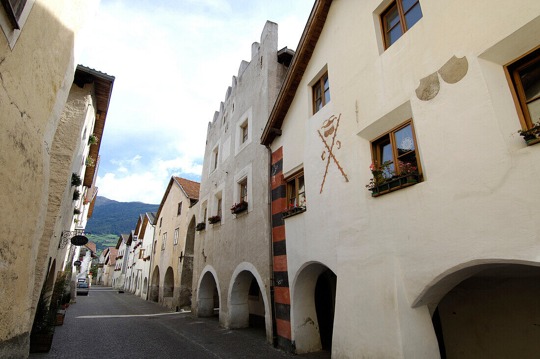 An alley and houses at the Old Town, Glurns, Val Venosta, South Tyrol, Italy, Europe