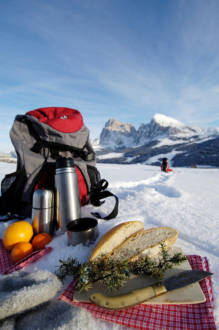 Picnic in the snow, Hiking in the Alps, Seiser Alp, Langkofelgruppe, Dolomites, South Tyrol, Italy
