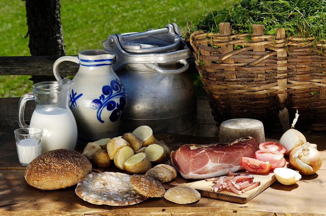 Picnic with South Tyrolean ham, bread and potatoes, Alpine meadow, Agriculture, South Tyrol, Italy