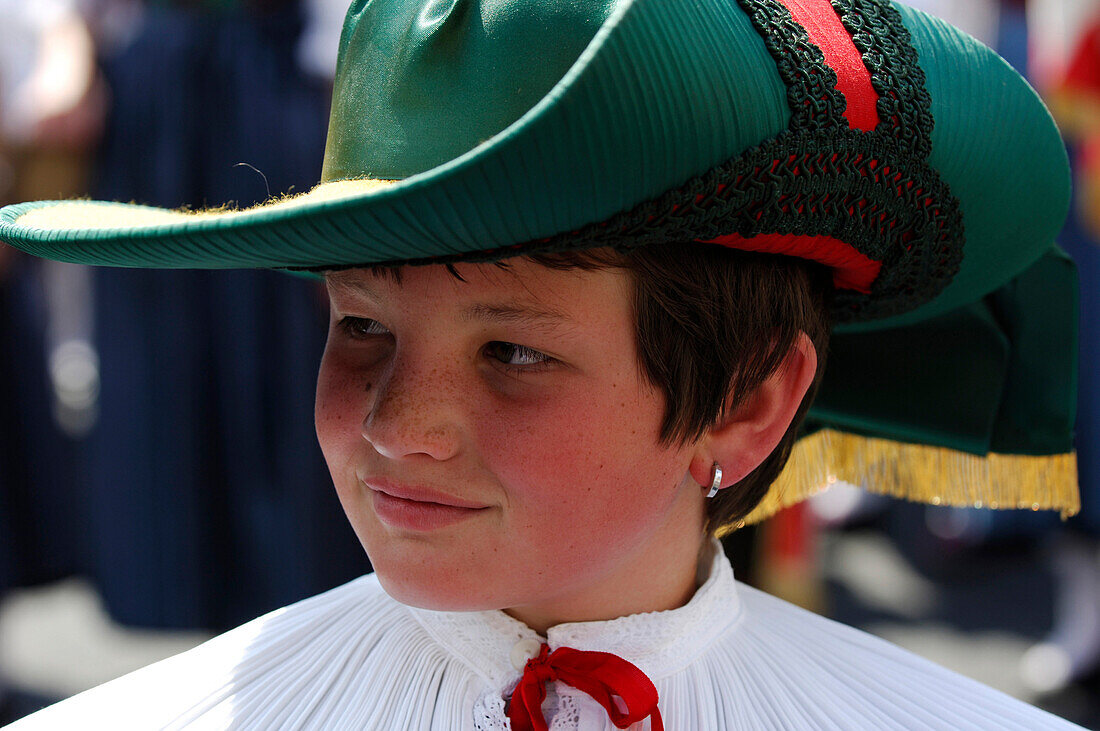 Detail of traditional costume in Kastelruth, boy wearing hat, music band, Kastelruth, South Tyrol, Italy