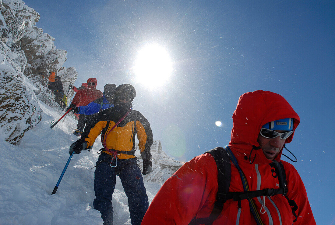 Mountaineers, climbers in Winter clothing descending the mountain, Mountain landscape, Wildspitze, South Tyrol, Italy