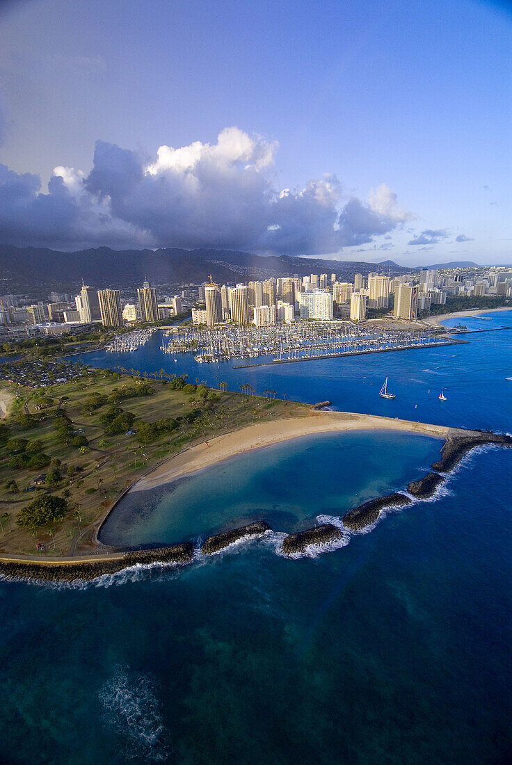 Aerial view of Ala Moana Regional Park (Magic Island) with Ala Wai Yacht Harbor and Waikiki in back, Honolulu, Oahu, Hawaii, USA