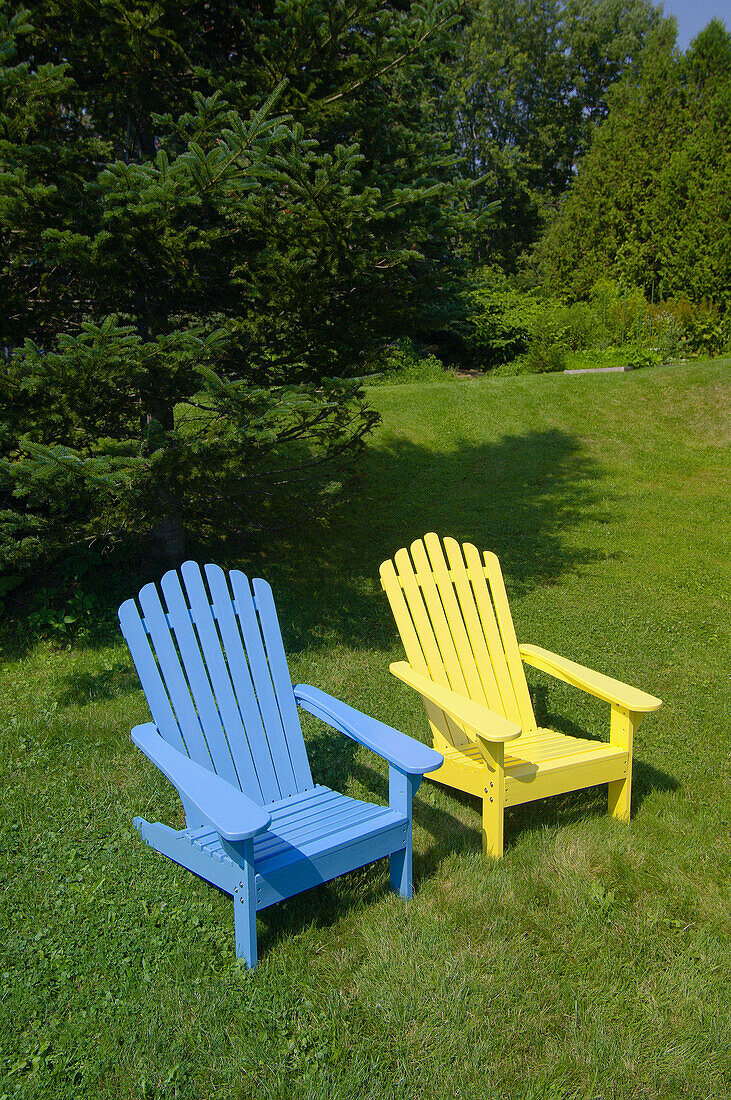 Adirondack chairs in the back garden of a home in Castine, Penobscot Bay, Maine USA