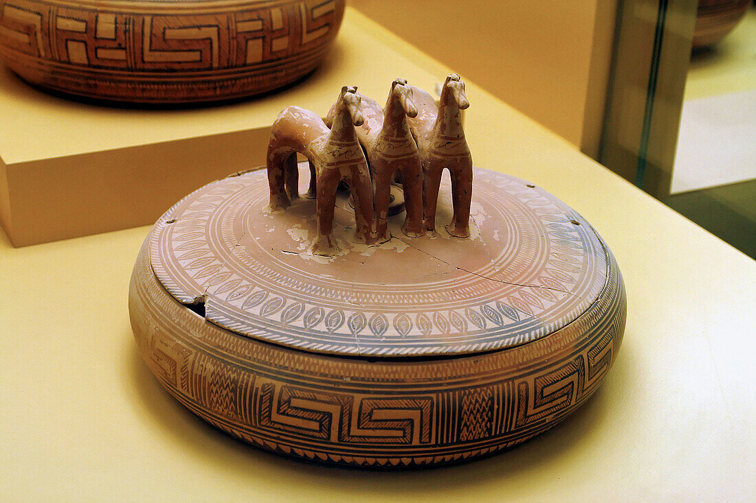 Greek pottery: pyxis with three terracotta horses-shaped handle in the Ancient Agora Museum (Stoa of Attalos), Athens. Greece