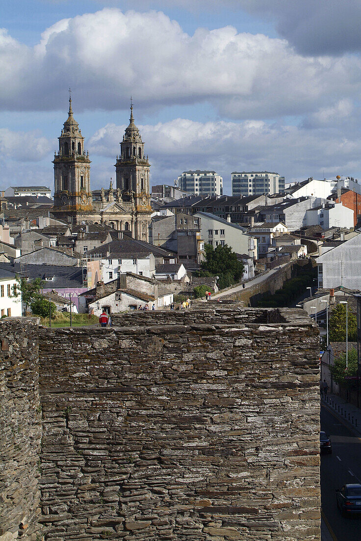 Lugo. Galicia. Spain. Roman walls (Lucus Augusti, old roman town) and Santa Maria cathedral in background.
