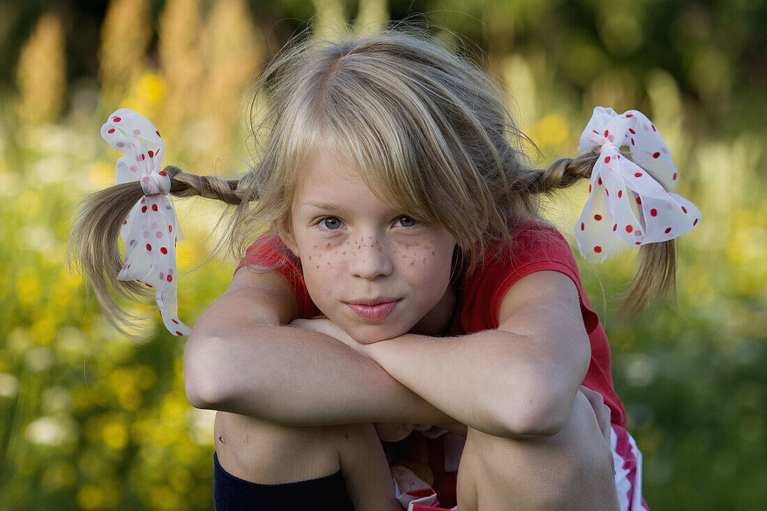 Girl with braids (pigtails) in her hair enjoying the summer, costume party theme