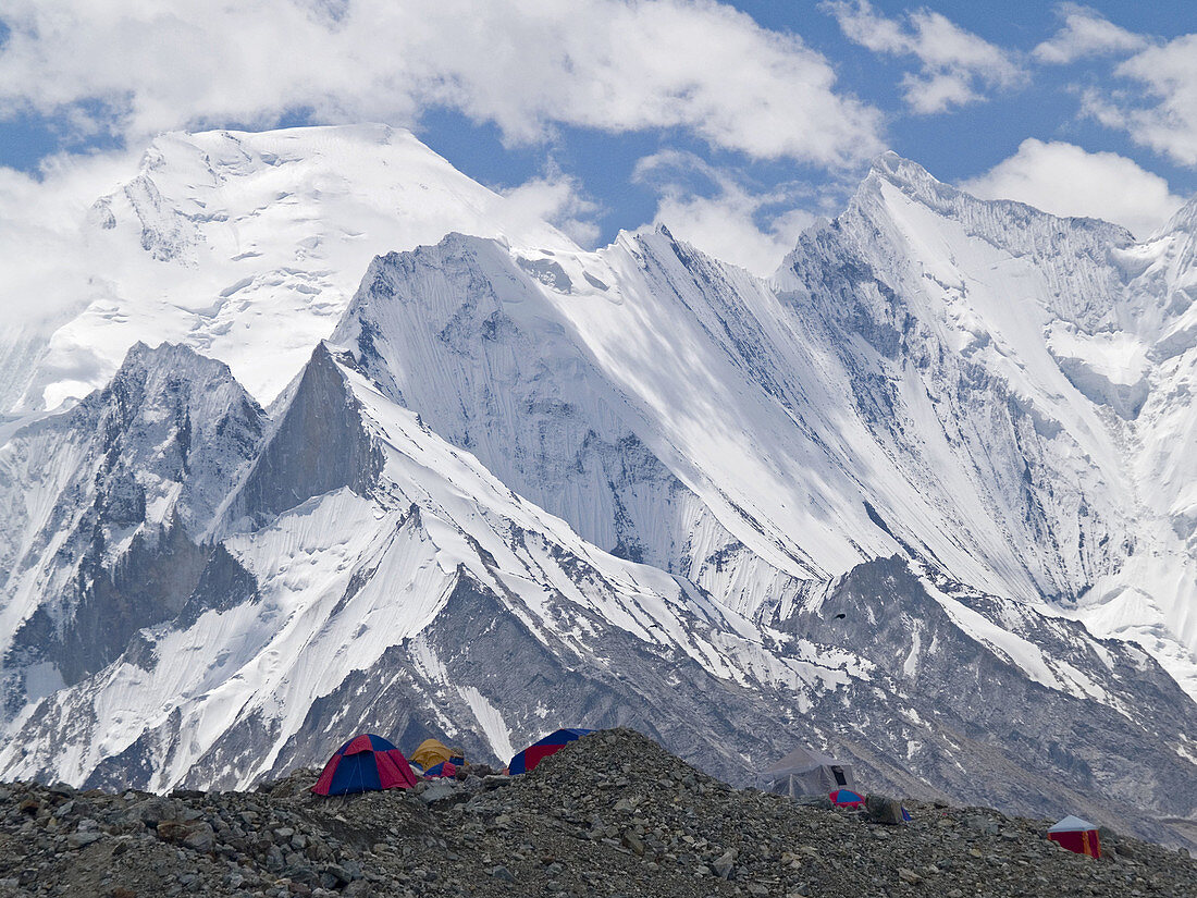 Tents on the glacier near Broad Peak Basecamp, with the stunning peaks of Concordia behind, Karakoram Range, Pakistan