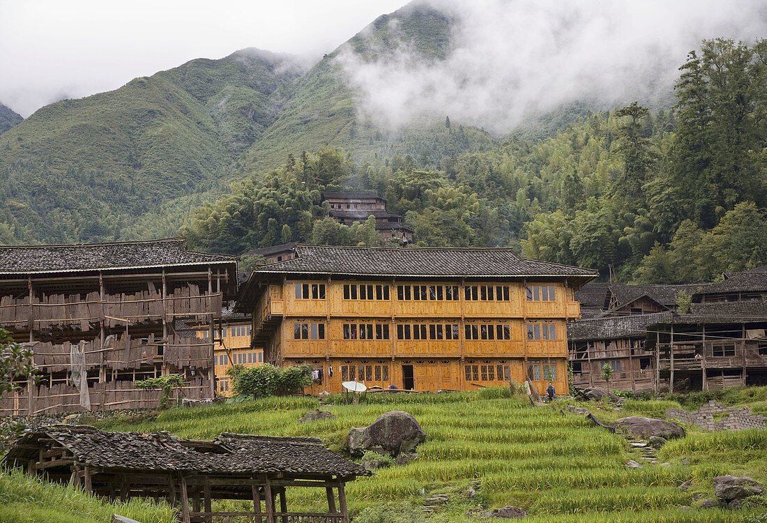 Old and new wood homes in a Red Yao village near Guilin, China