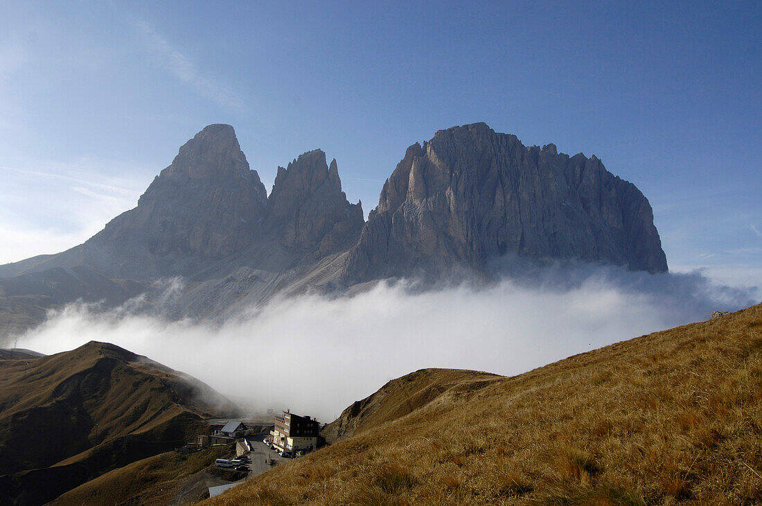 Hotel Maria Flora at a mountain pass in front of mountain tops in the morning mist, Dolomites, South Tyrol, Italy, Europe
