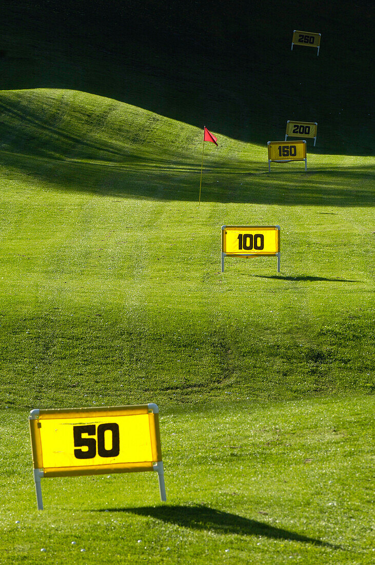 Flag and signs on the lawn, Golf court Kastelruth Alpe di Siusi, Sciliar, South Tyrol, Italy, Europe