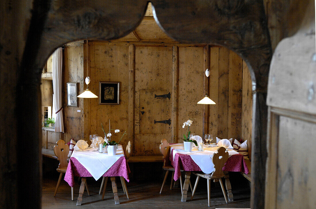 Tables are laid at the dining area of restaurant Steinbock, Villanders, Valle Isarco, South Tyrol, Italy, Europe