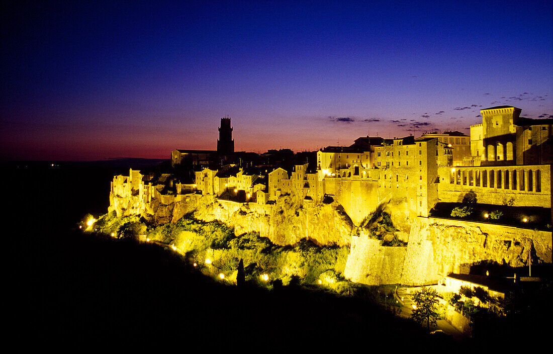 View at the illuminated small town Pitigliano in the evening, Tuscany, Italy, Europe